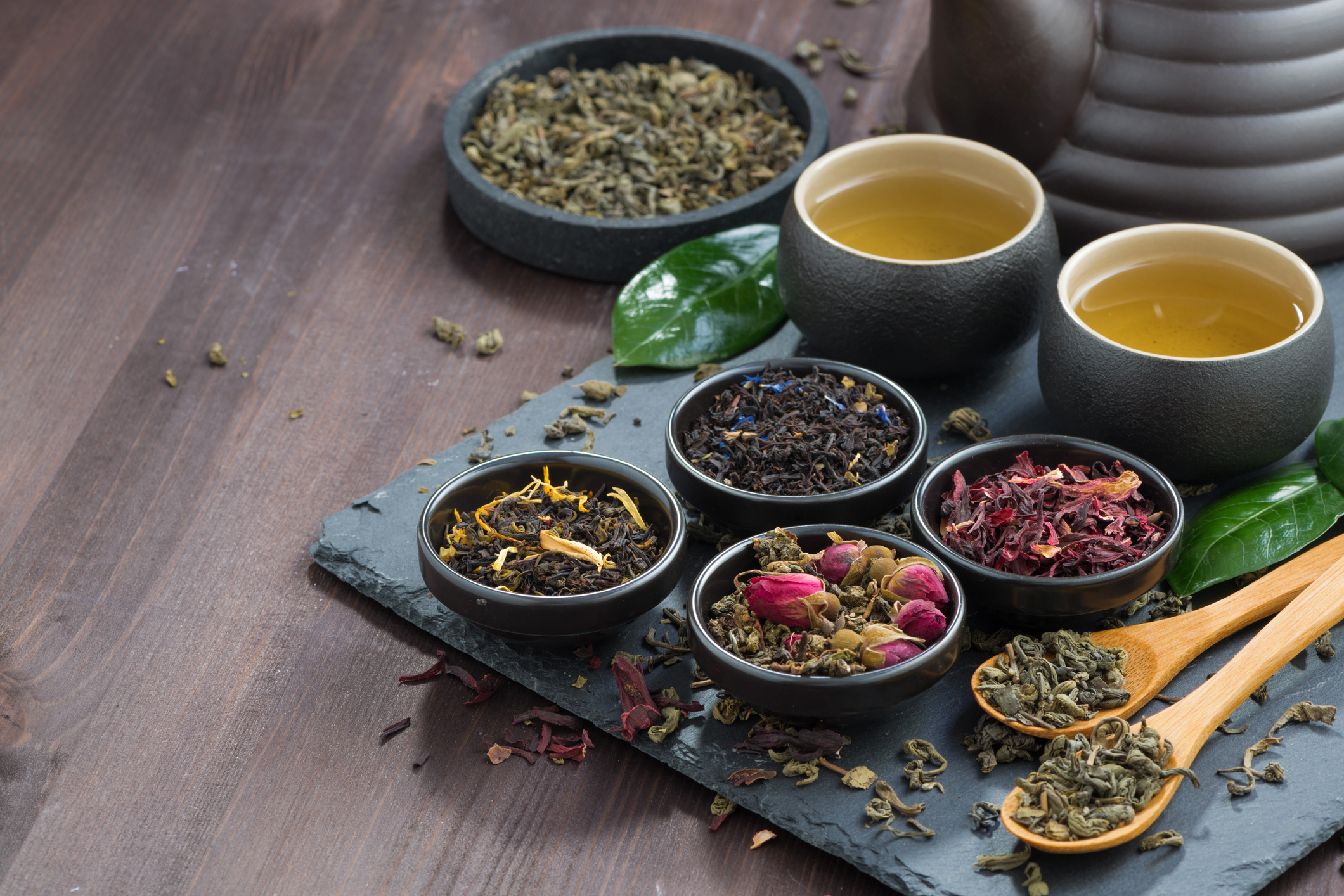 assortment of fragrant dried teas and green tea